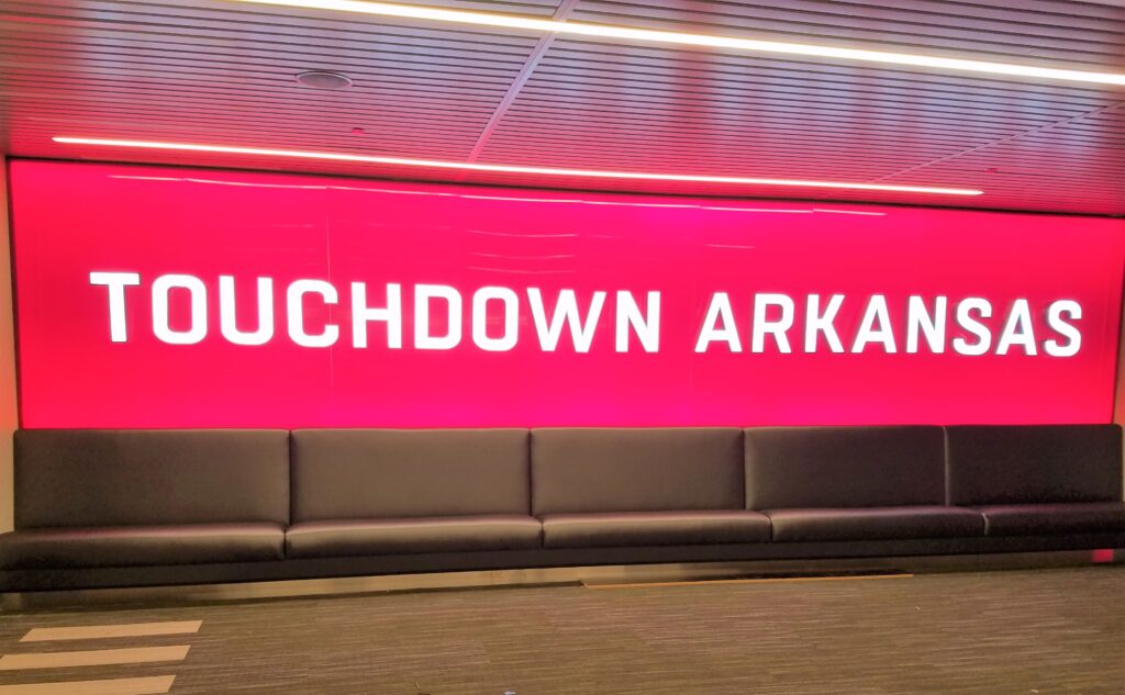 A red sign that says touchdown arkansas.